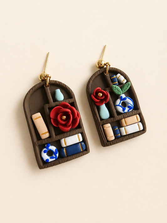 book-inspired handmade polymer clay earrings with floral details