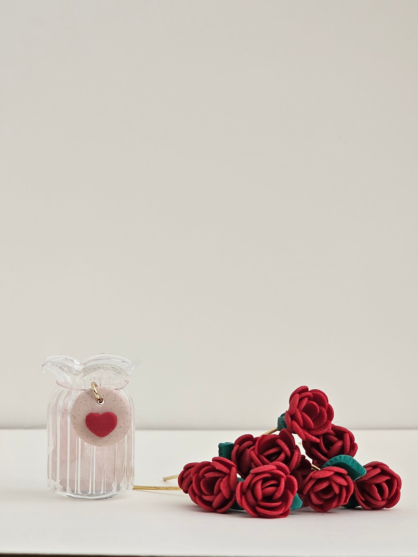 Red rose hair accessory on a white background