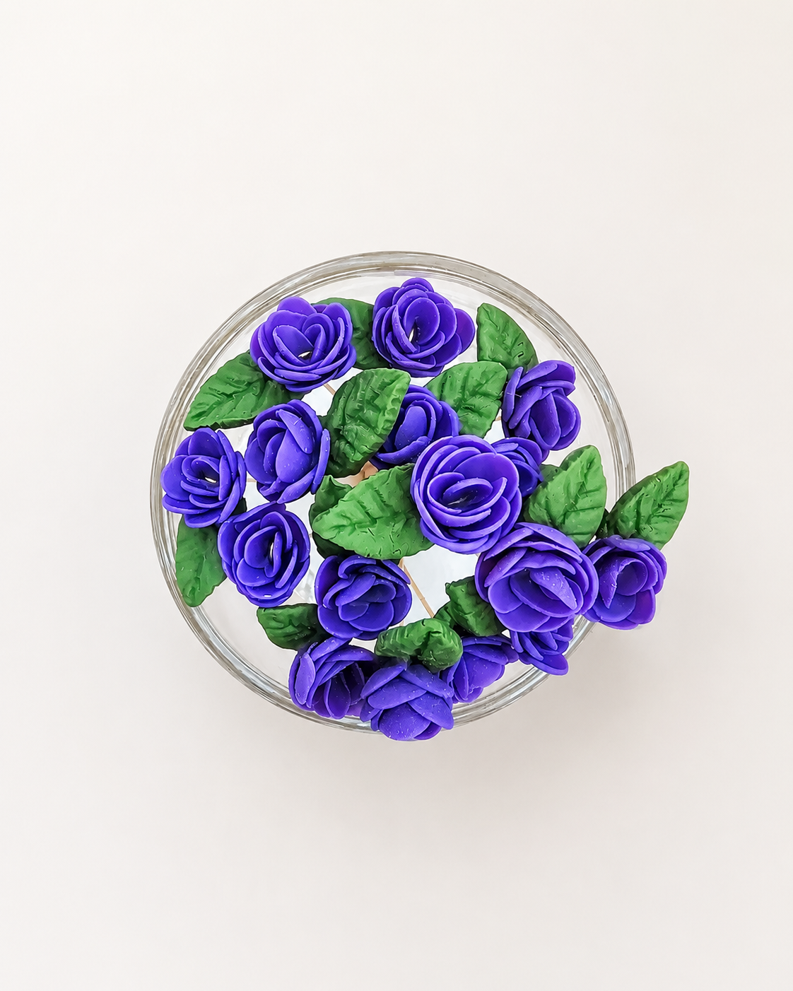 A pot of deep purple roses