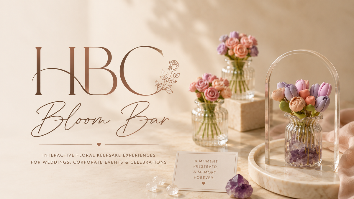 Soft beige promotional banner for HBC Bloom Bar featuring handmade polymer clay floral keepsakes in delicate glass vases. The elegant 16:9 design showcases pastel tulips and roses with crystal accents, styled in a warm romantic setting for weddings, corporate events and meaningful celebrations.
