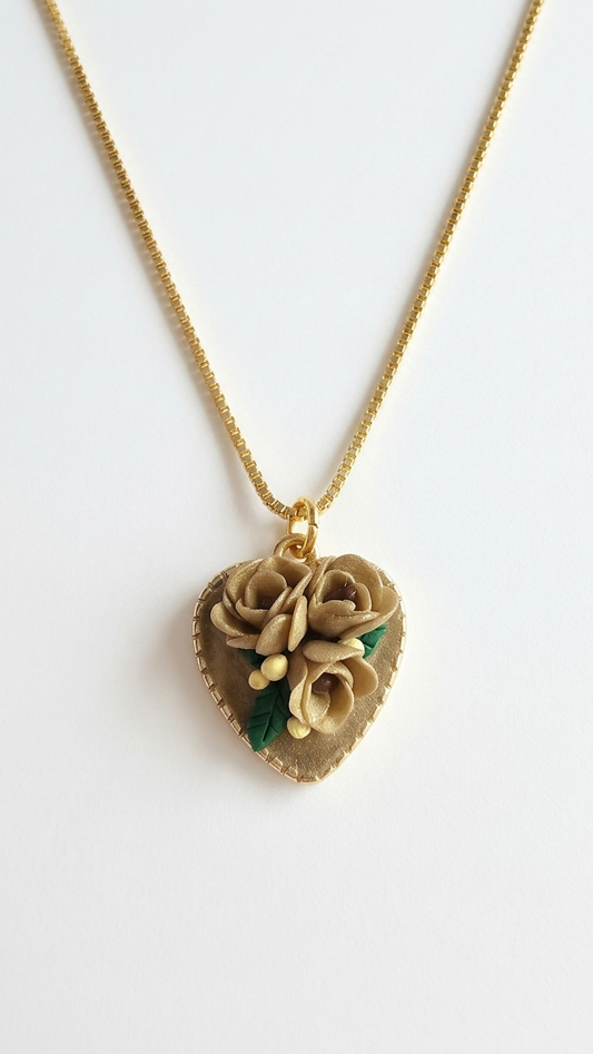 Heart-shaped necklace with floral design on a white background