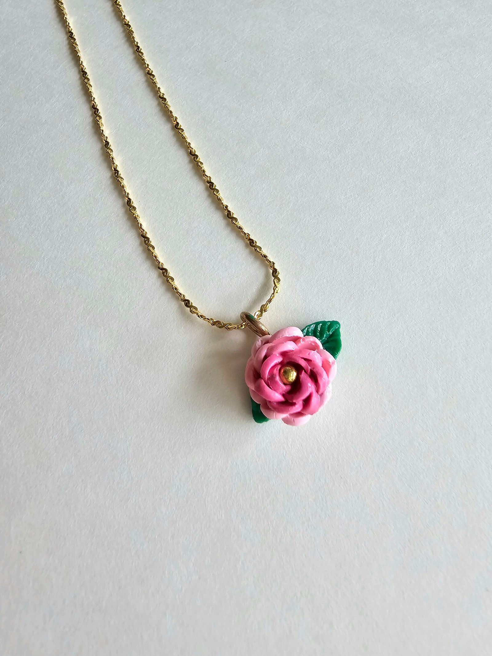 Gold plated 925 silver necklace with a petite handmade pink polymer clay rose and green leaf detail