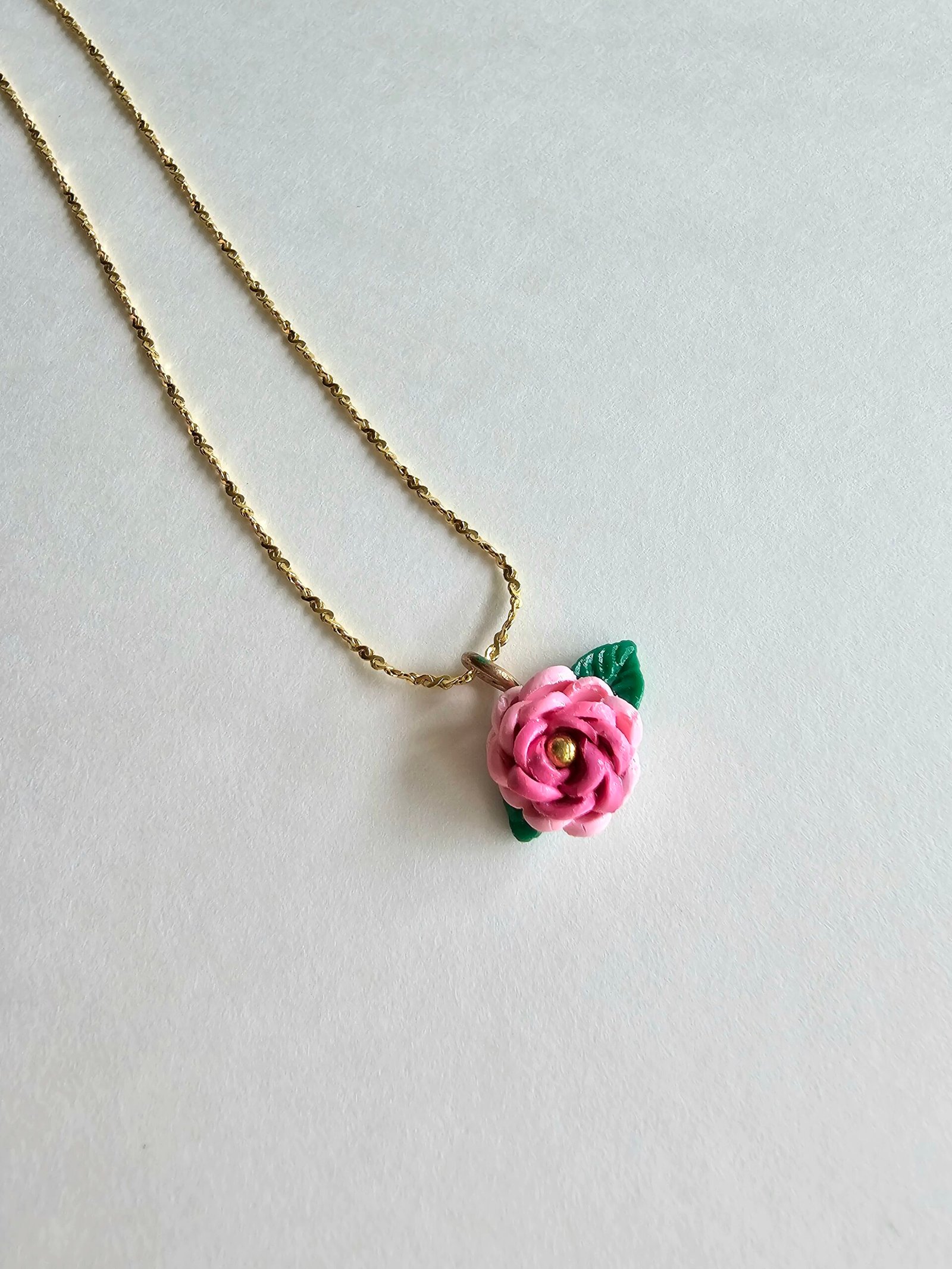 Gold plated 925 silver necklace with a petite handmade pink polymer clay rose and green leaf detail