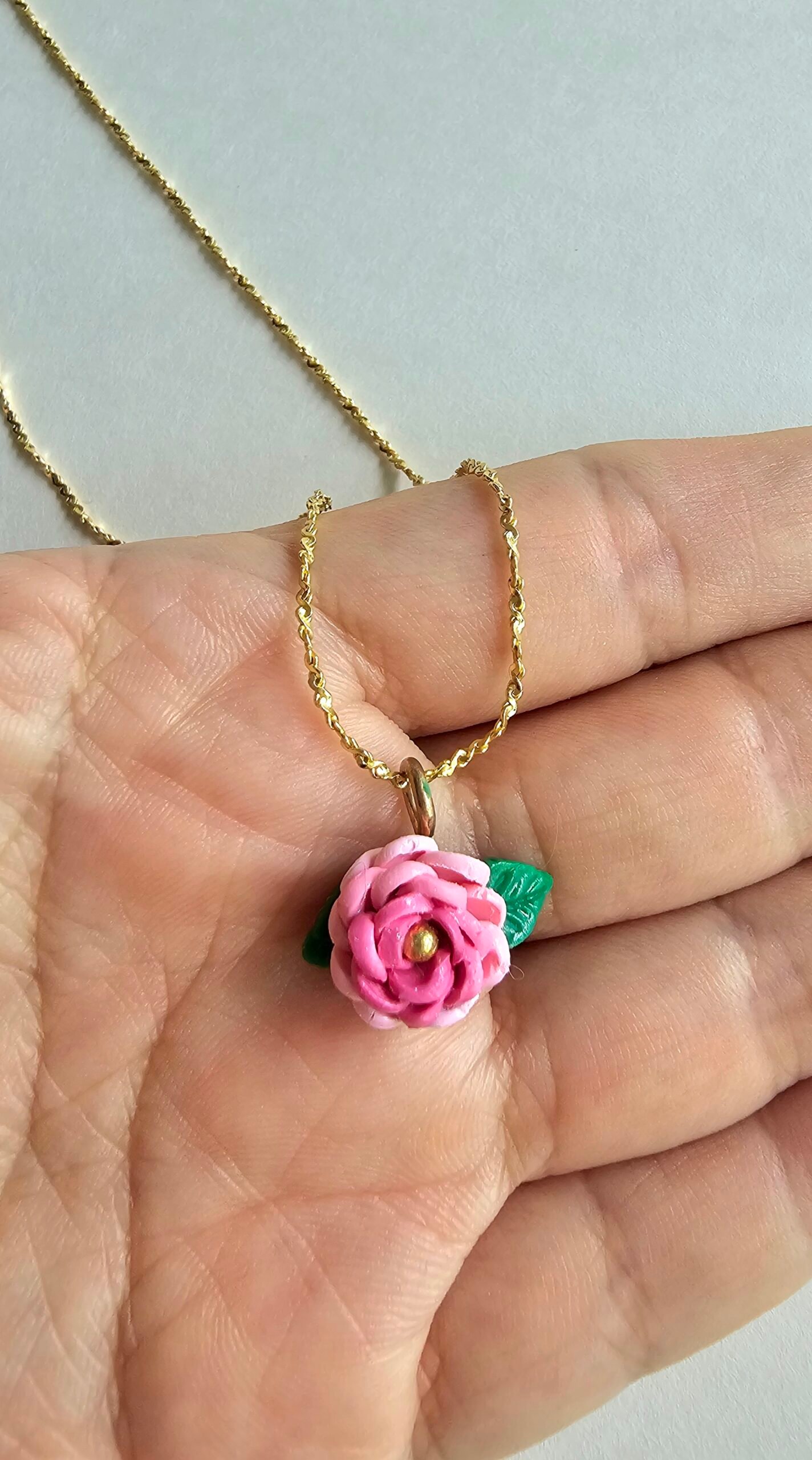 Gold plated 925 silver necklace with a petite handmade pink polymer clay rose and green leaf detail