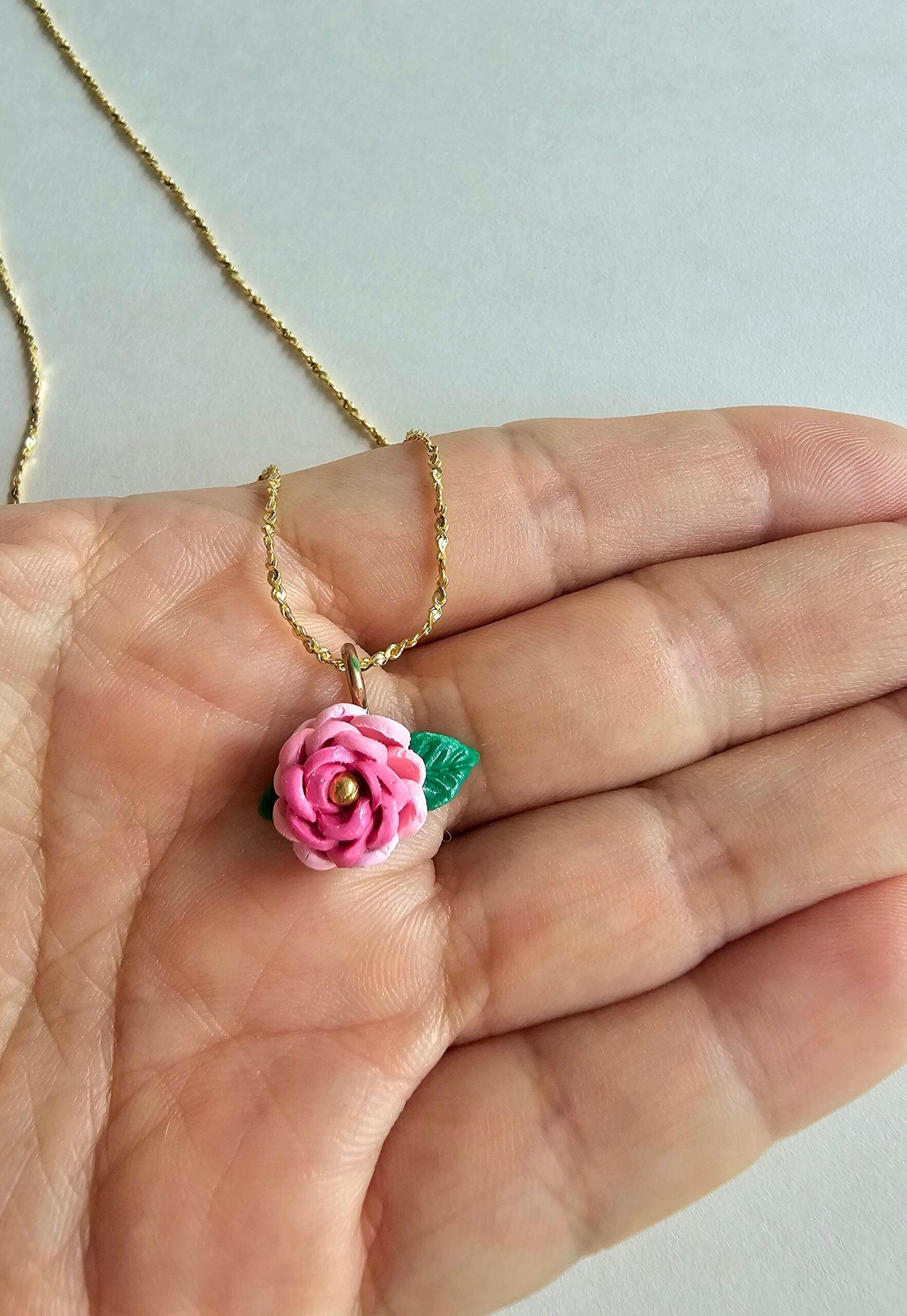 Gold plated 925 silver necklace with a petite handmade pink polymer clay rose and green leaf detail