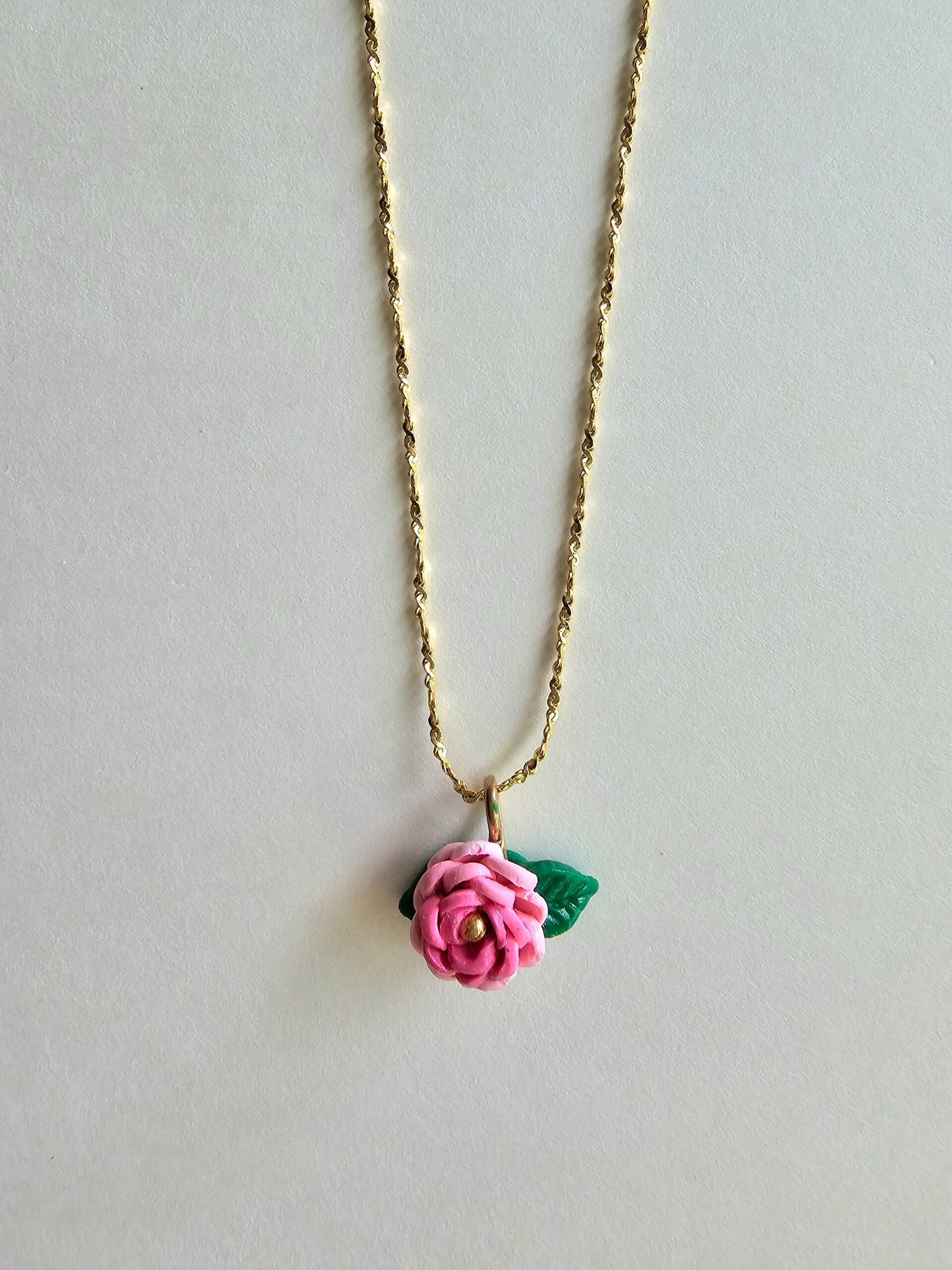 Gold plated 925 silver necklace with a petite handmade pink polymer clay rose and green leaf detail