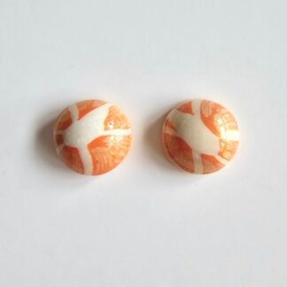 Handmade polymer clay citrus stud earrings in marbled orange and cream